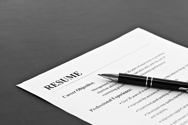 Resume on the Table Closeup of Resume with Pen on the Table