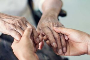 Mental-Health-First-Aid Holding Elderly Persons Hands
